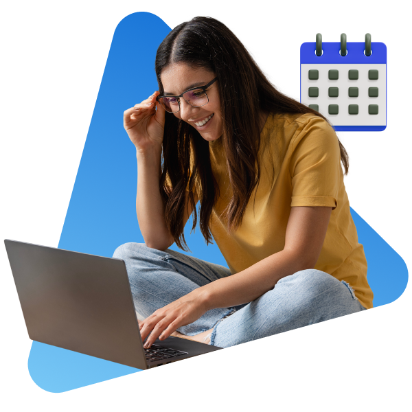 Girl smiling at computer screen